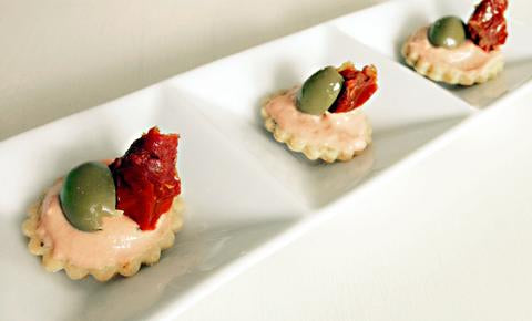 Parmesan taler ( biscuits) with cream cheese, olives and dried tomatoes