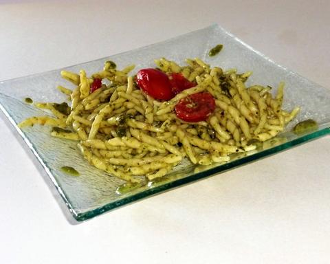 Trofie with pesto with cherry tomatoes